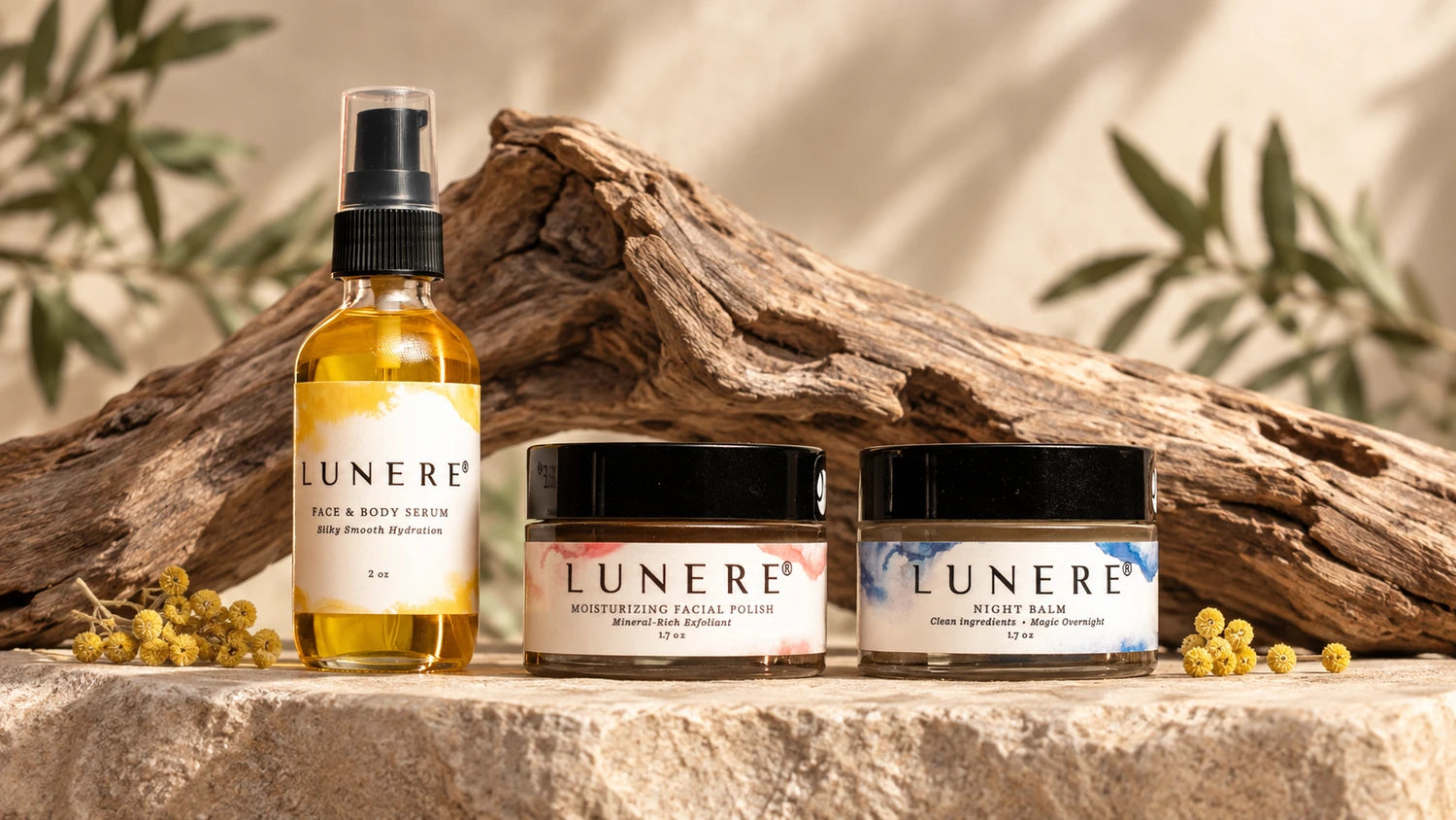 All three Lunere skincare products together with sculptural wood and botanical ingredients
